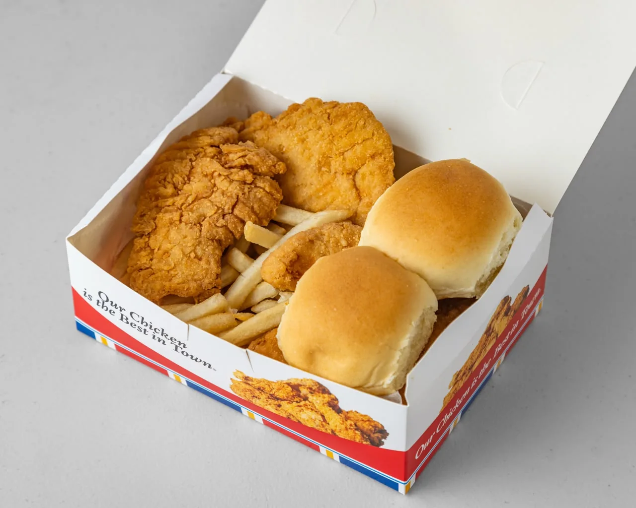 Chicken tenders with fries and rolls